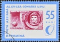 cancelled postage stamp printed by Romania, that shows Stamp with Yuri Gagarin, globe with orbit