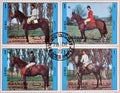 Cancelled postage stamp printed by Sharjah and dependencies, that shows Horse riding