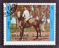 Cancelled postage stamp printed by Sharjah and dependencies, that shows Horse riding