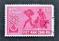 Cancelled postage stamp printed by South Vietnam, that shows Refugee Family