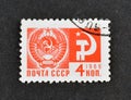 Cancelled postage stamp printed by Soviet Union, that shows Coat of Arms of the USSR, Hammer and Sickle Royalty Free Stock Photo