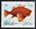 Cancelled postage stamp printed by State of Oman, that shows Rascasse fish