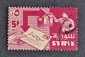 Cancelled postage stamp printed by Syria, that shows Mailing and receiving letter