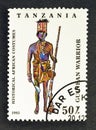 Cancelled postage stamp printed by Tanzania, that shows Guinean warrior