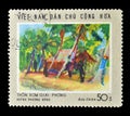 Cancelled postage stamp printed by Vietnam, that shows `Newly - liberated hamlet` - painting by Huynh Phuong Dong