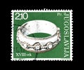 Cancelled postage stamp printed by Yugoslavia, that shows Antique silver ring