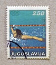 Cancelled postage stamp printed by Yugoslavia, that shows Swimming, Summer Olympics in Munich Royalty Free Stock Photo