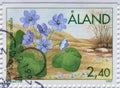 Cancelled postage stamp printed by Ãâ¦land Islands, that shows Kidneywort flower