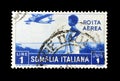 Cancelled postage tamp printed by Somalia, Italian Administration , that shows Girl watching airplane