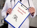 Cancer Health Disparities inscription on the page Royalty Free Stock Photo