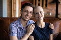 Hopeful husband embracing shoulders of wife recovering from oncology Royalty Free Stock Photo