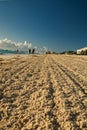 Cancun beech  golden sand is smoothed out with tracter and plough Royalty Free Stock Photo