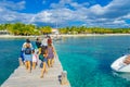 CANCUN, MEXICO - JANUARY 10, 2018: Beautiful outdoor view of unidentified tourist walking over a wooden pier in the Isla