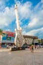 CANCUN, MEXICO - JANUARY 10, 2018: Unidentified people at outdoors next to Hard Rock Cafe metallic guitar structure in