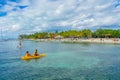 CANCUN, MEXICO - JANUARY 10, 2018: Unidentified people paddling in their kayack in a beautiful caribbean beach isla Royalty Free Stock Photo