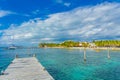 CANCUN, MEXICO - JANUARY 10, 2018: Unidentified people swimming in the shore and other paddling in their kayack in a Royalty Free Stock Photo