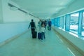 CANCUN, MEXICO - JANUARY 10, 2018: Unidentified people walking carrying their luggages in a hall inside of the Cancun