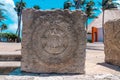 Close up of maya souvenirs carved on stone at pavement in resort