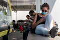 Cancun. Quintanaroo, Mexico. 08.17.2020 Real woman wearing a protective mask while waiting for a rental car to be delivered to her Royalty Free Stock Photo