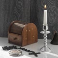 Candelabra with candle, inlaid jewelry box, women`s mirror. Royalty Free Stock Photo