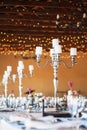 Candelabra with candles on decorated wedding reception tables Royalty Free Stock Photo