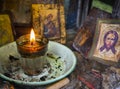 Candelakia - traditional miniature Church by the road in the forest with a burning candle and icons inside on island Evia in Greec