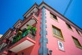 Fragment of the facade of a beautiful building on a shopping street of a small seaside town