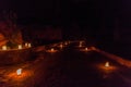 Candels along the Siq (narrow gorge, main entrance to the ancient city Petra) during Petra by Night, Jord