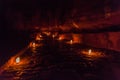 Candels along the Siq (narrow gorge, main entrance to the ancient city Petra) during Petra by Night, Jord