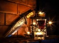 Candels light and dagger on fireplace