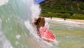 Candice Appleby Surfing a Wave at the Beach Royalty Free Stock Photo