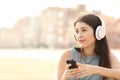 Candid girl listening music with a smartphone