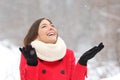 Candid happy girl enjoying snow in winter