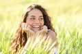 Candid happy woman smiling in a field