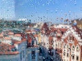 A candid, naturalistic view of a cityscape through a rain-spattered window Royalty Free Stock Photo