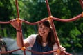 Candid people adorable cheerful girl portrait photography in park outdoor summer time day space with foreground frame work objects