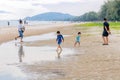 Candid photo oh little chidren playing together at Hua Hin Beach on holiday. Hua Hin, Thailand October 14, 2017