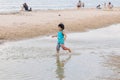 Candid photo oh little chidren playing together at Hua Hin Beach on holiday. Hua Hin, Thailand October 14, 2017