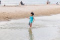 Candid photo oh little chidren playing together at Hua Hin Beach on holiday. Hua Hin, Thailand October 14, 2017