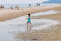 Candid photo oh little chidren playing together at Hua Hin Beach on holiday. Hua Hin, Thailand October 14, 2017