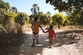 Candid Picture of Two African Black Boys Children Walking Cheerful Joyful Outside