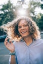 Candid portrait of beautiful young woman laughing in the street Royalty Free Stock Photo