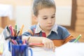 Candid portrait of a boy doing his homework and studying at home Royalty Free Stock Photo