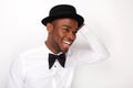 Candid portrait of happy man laughing with bowtie and hat Royalty Free Stock Photo