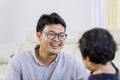 Candid portrait of man smiling while talking