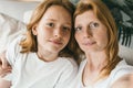 Candid portrait of mother and teenager girl