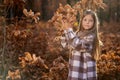 Young caucasian girl, candid autumnal portrait in the forest Royalty Free Stock Photo