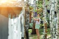 Candid real life portrait of young adult beautiful attractive caucasian woman hanging up fresh washed family clothes on Royalty Free Stock Photo