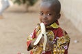 Candid Shot of African Black Boy Eating Banana Outdoor