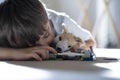 Candid shot sleeping while playing with toys, Selective focus Chiled taking a nap in afternoon, Low view  of little boy relaxin g Royalty Free Stock Photo